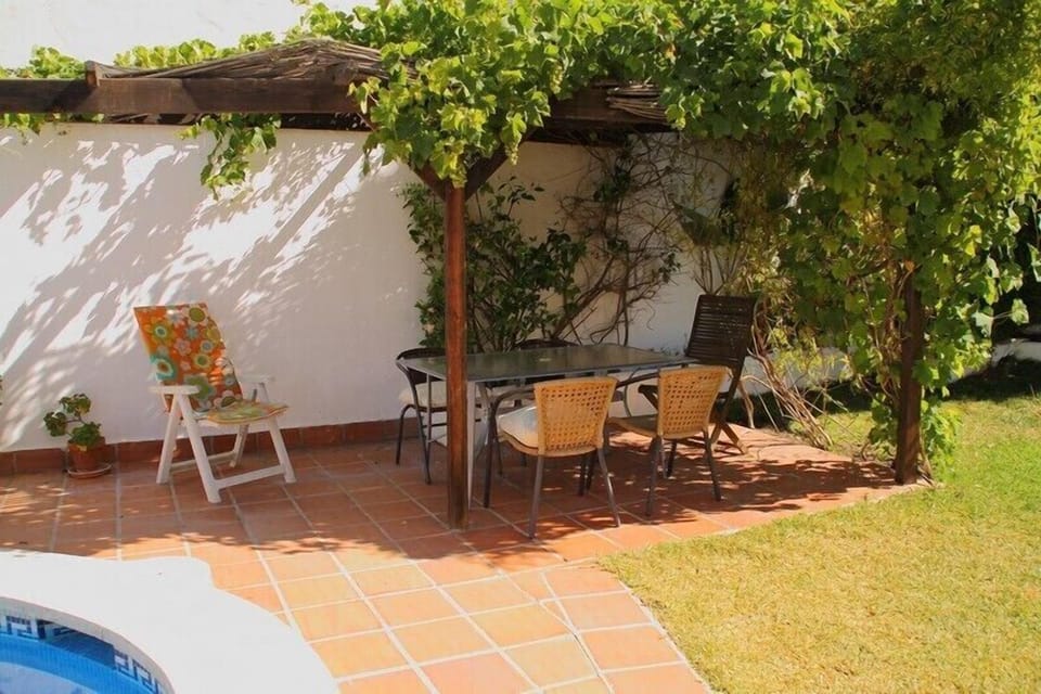 shaded pergola on the pool terrace