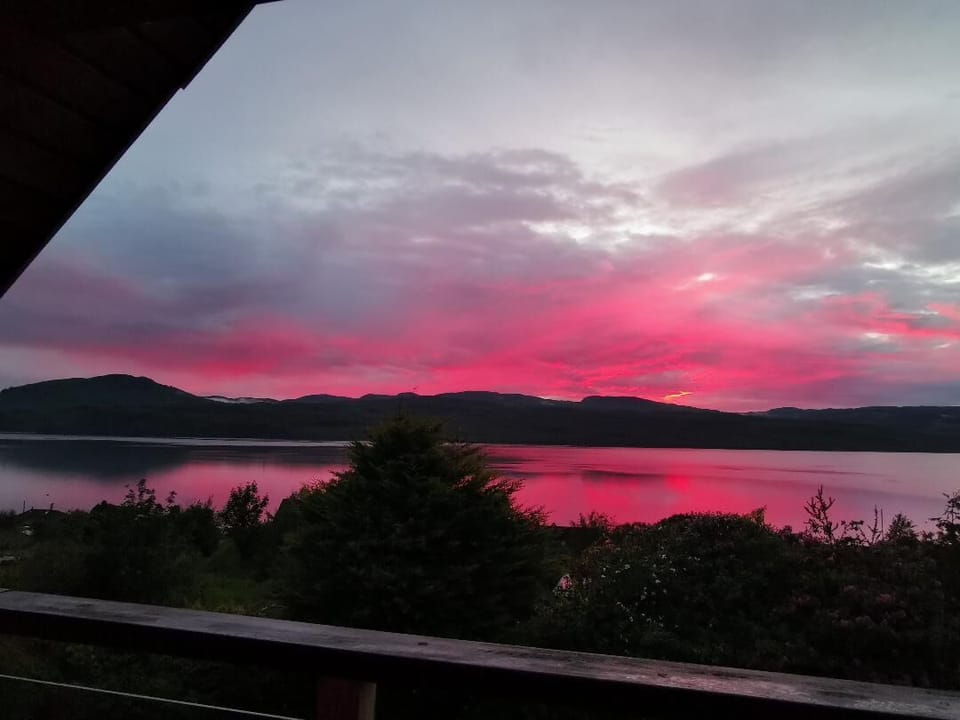 Summer sunset over loch. Photo taken from the covered, upper balcony of Ardfyne.