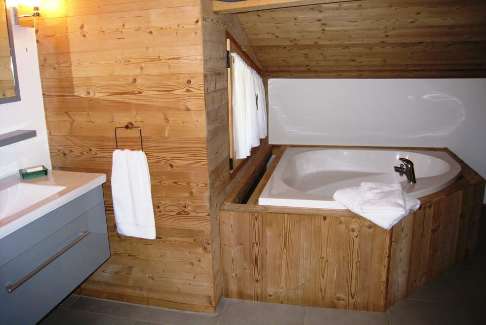 Family bathroom with heart shaped tub