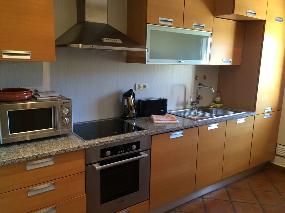 Kitchen including: oven, microwave, fridge/freezer, dishwasher & coffee machine