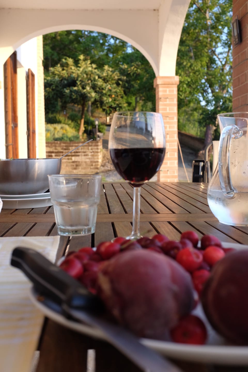 The loggia is a lovely place to eat lunch or dinner - please eat our cherries!