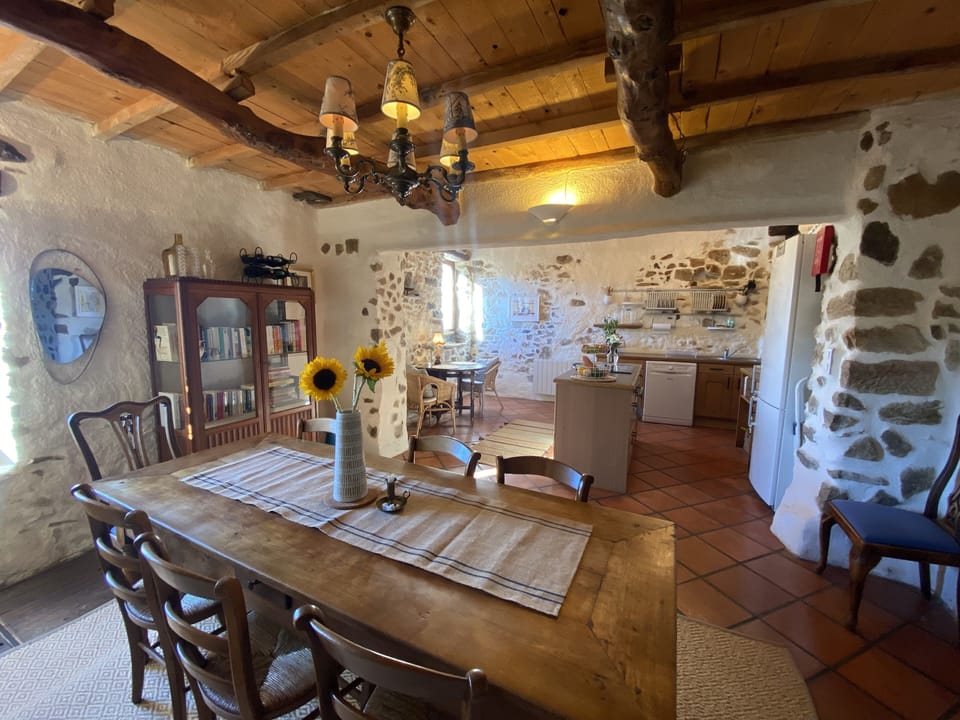 The dining area seats 6-8 and looks into the open plan kitchen