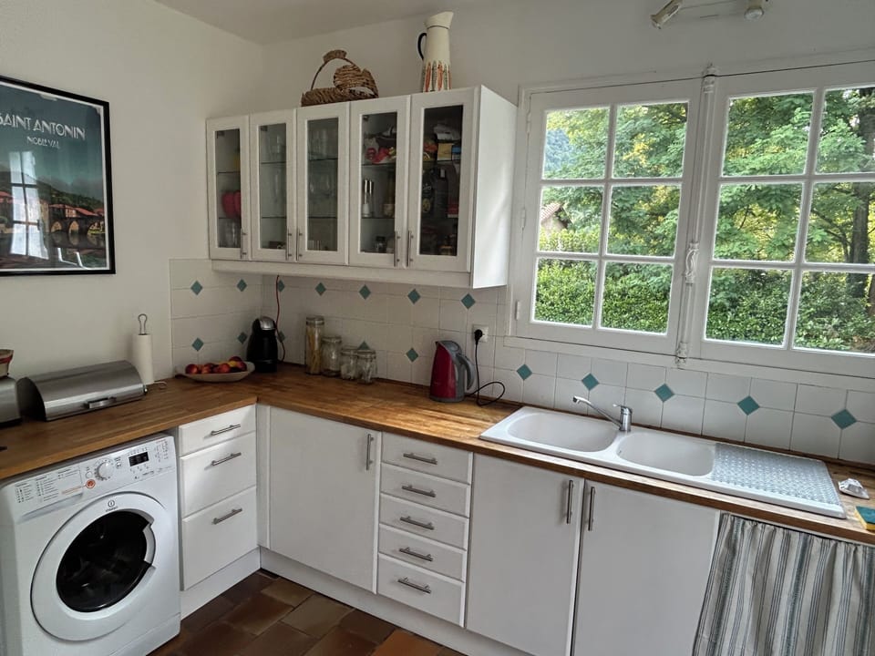 Kitchen with window overlooking pool.