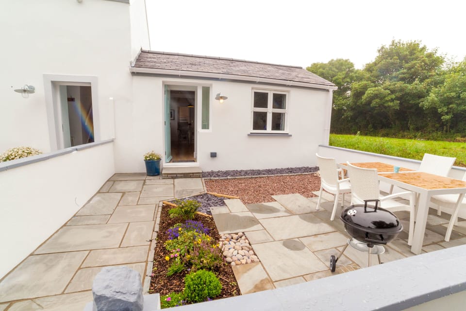 Outdoor space with secure gate, patio furniture and BBQ. All carefully designed.