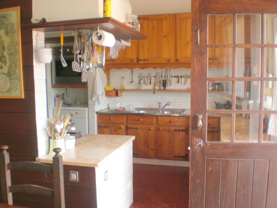 one end of the kitchen, leading out to terrace