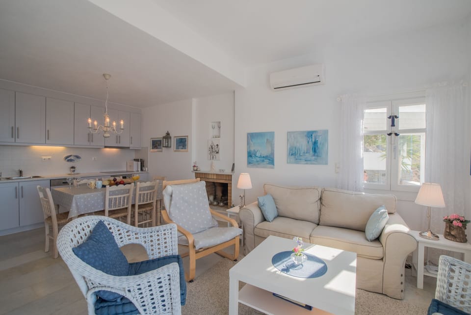 THE KITCHEN, DINING AND LIVING ROOM