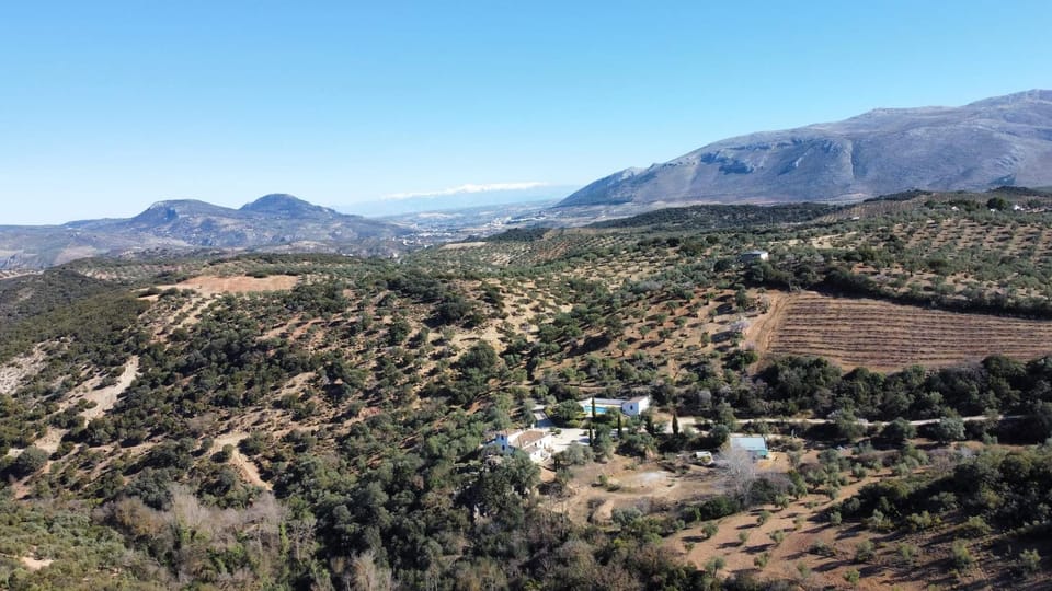Photographed by drone, showing the snow-capped Sierra Nevada in the distance
