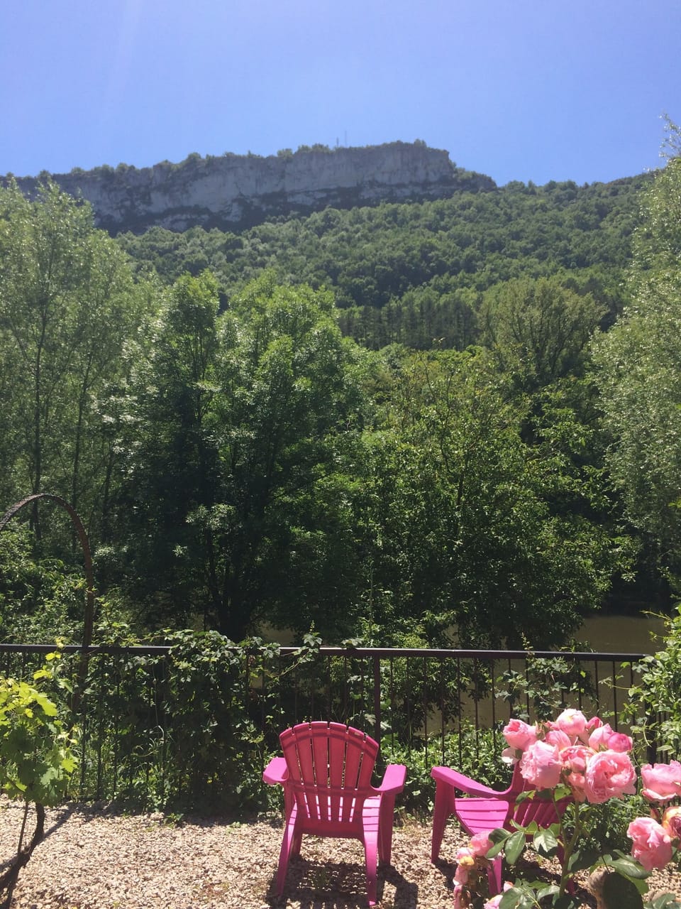 Views from the garden across the River Aveyron of the Roc d'Anglars