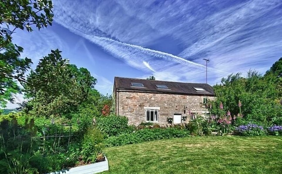 view of cottage across the farm garden