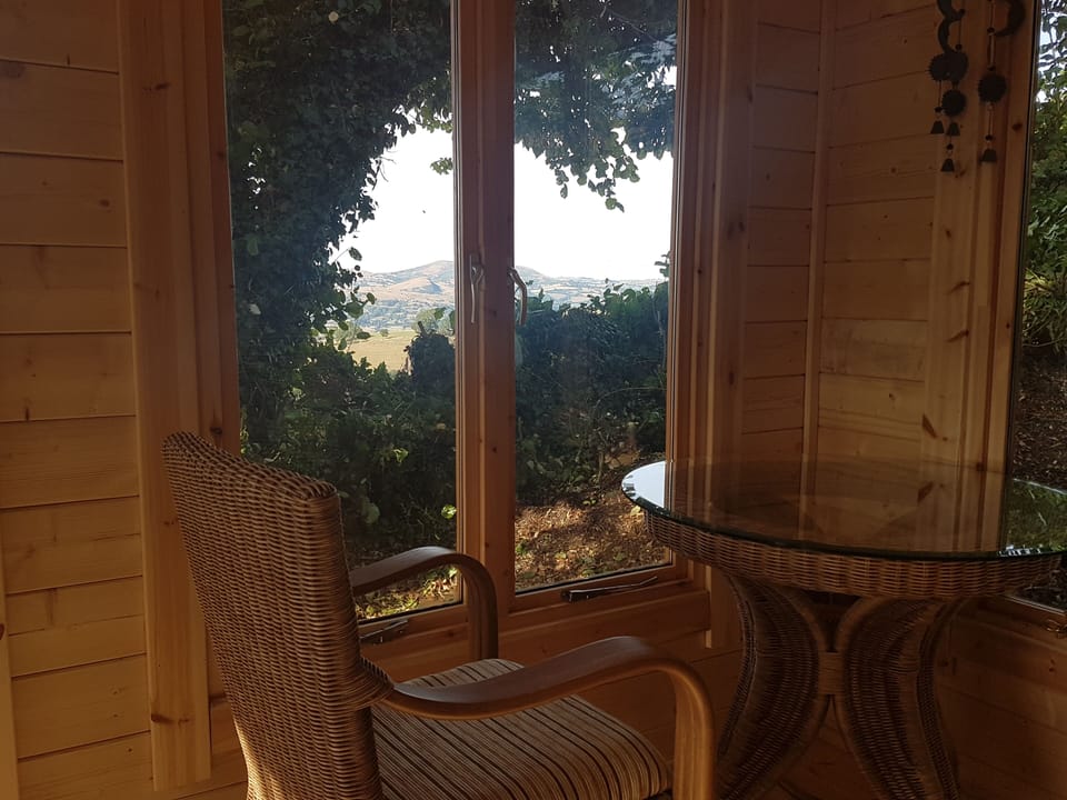 View from the garden summerhouse with its conservatory furniture