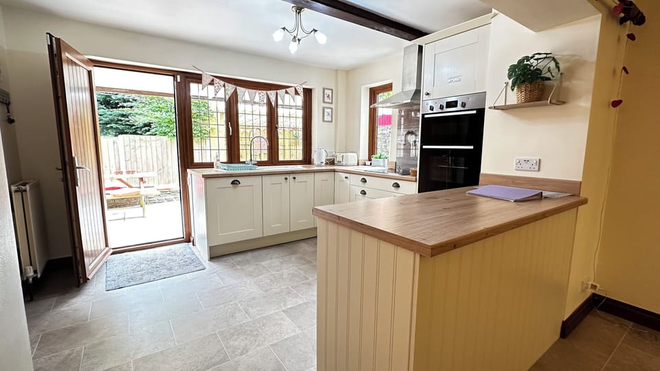 Bright Kitchen, leads straight to the garden.  There is a separate utility Room 