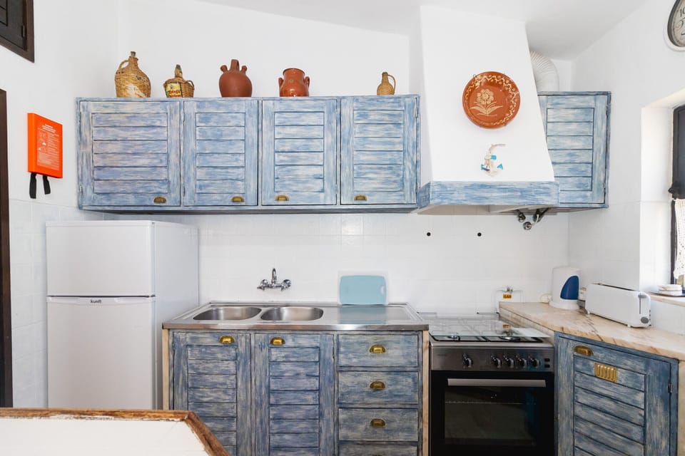 Blue wooden kitchen cabinets with stainless steel sink — Villa Alice, holiday villa in Albufeira