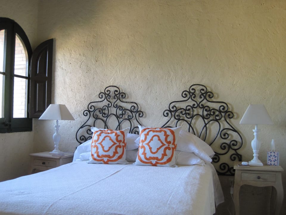 Bedrooms are individually decorated and feature arched or arrow loop windows
