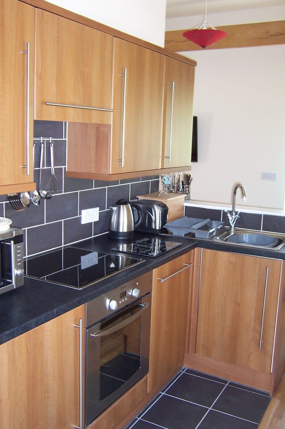 Fitted kitchen and beams in Rose's Rest at Greetham Retreat
