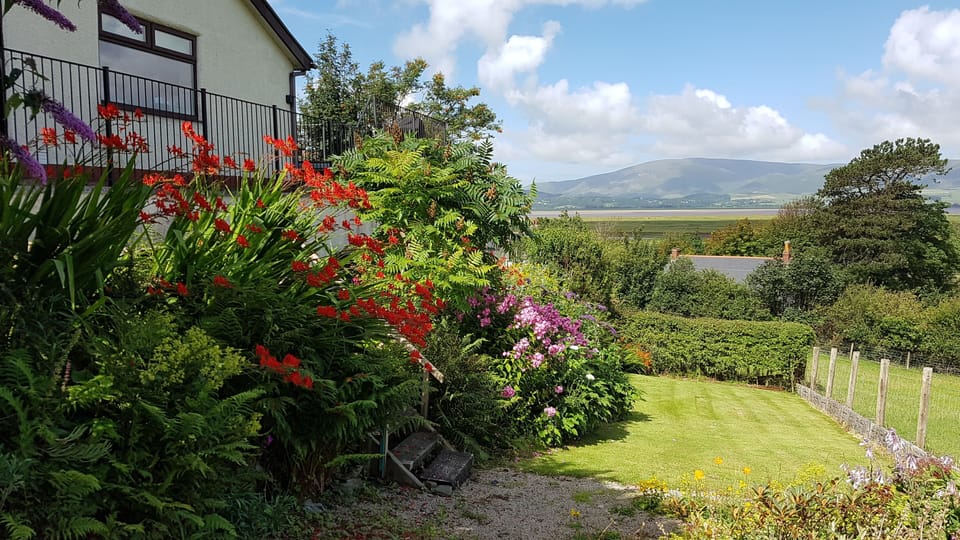Halsteads rear garden in summer looking to Black Combe