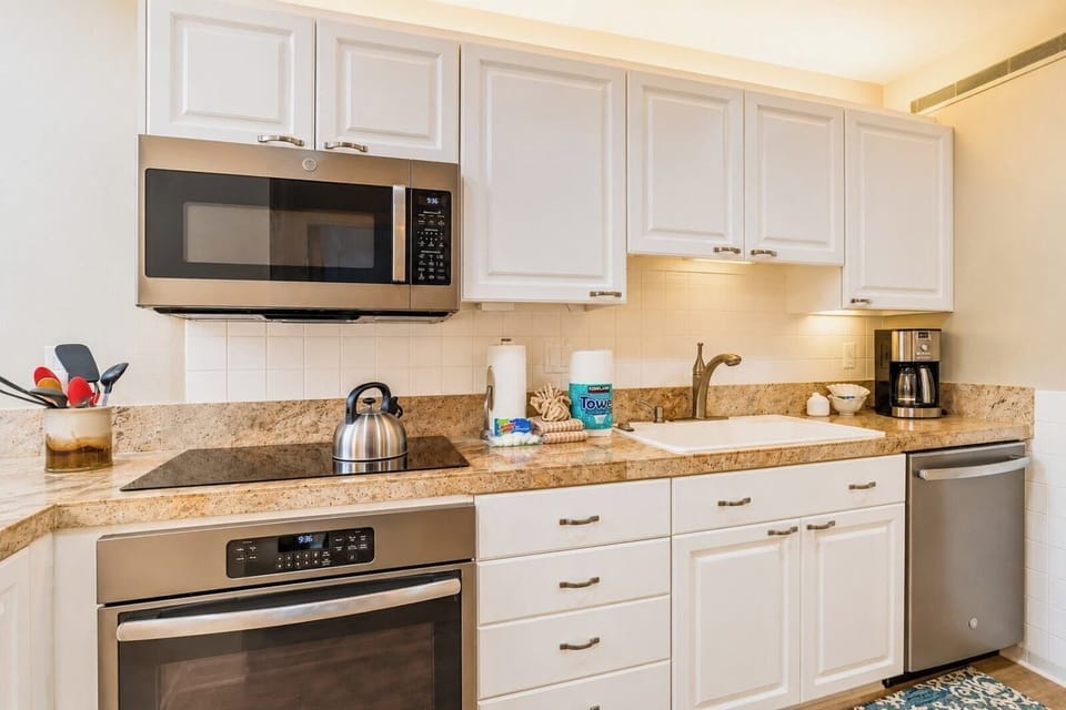 Fully equipped kitchen with modern appliances and ample space.
