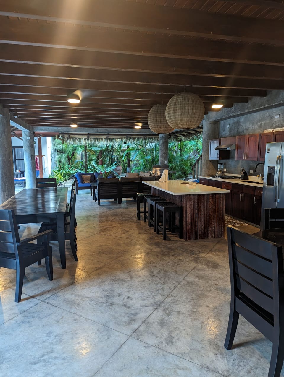 Rancho outdoor space with custom kitchen, 16 seat dining and lounge area