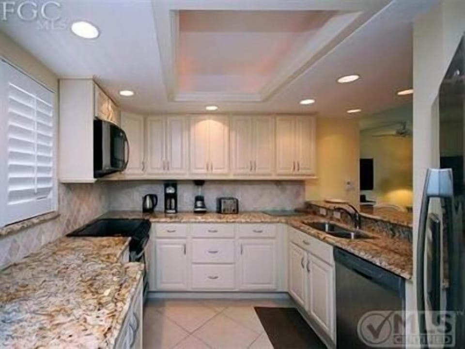 Entry view of fully equipped kitchen