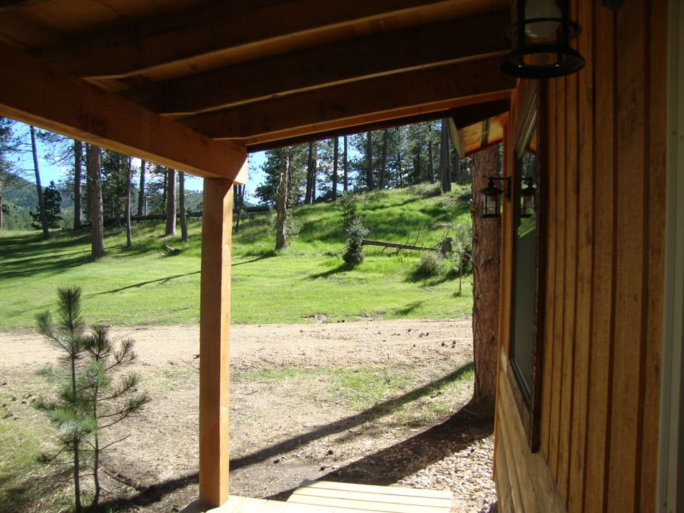 Covered porch provides a perfect place to sit and view wildlife and see the lake