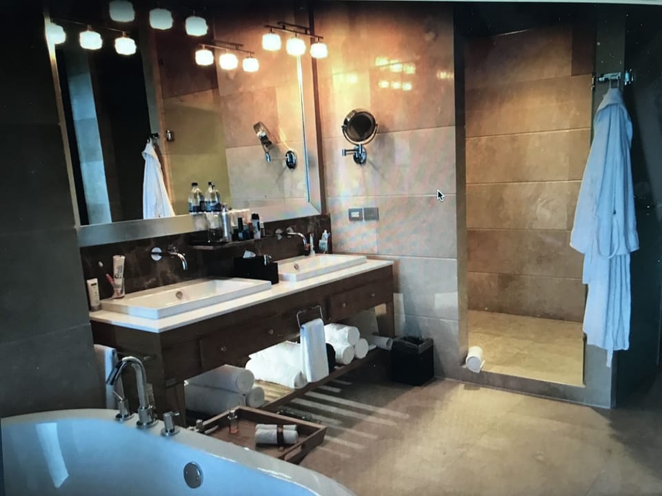 jetted tub, double sink and rain shower in each bathroom