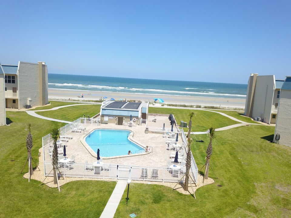 Drone view of pool and beach