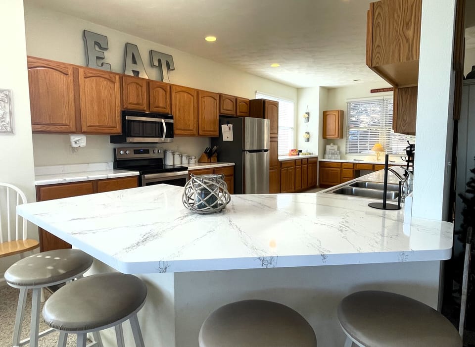 Newly updated kitchen with breakfast bar for extra seating