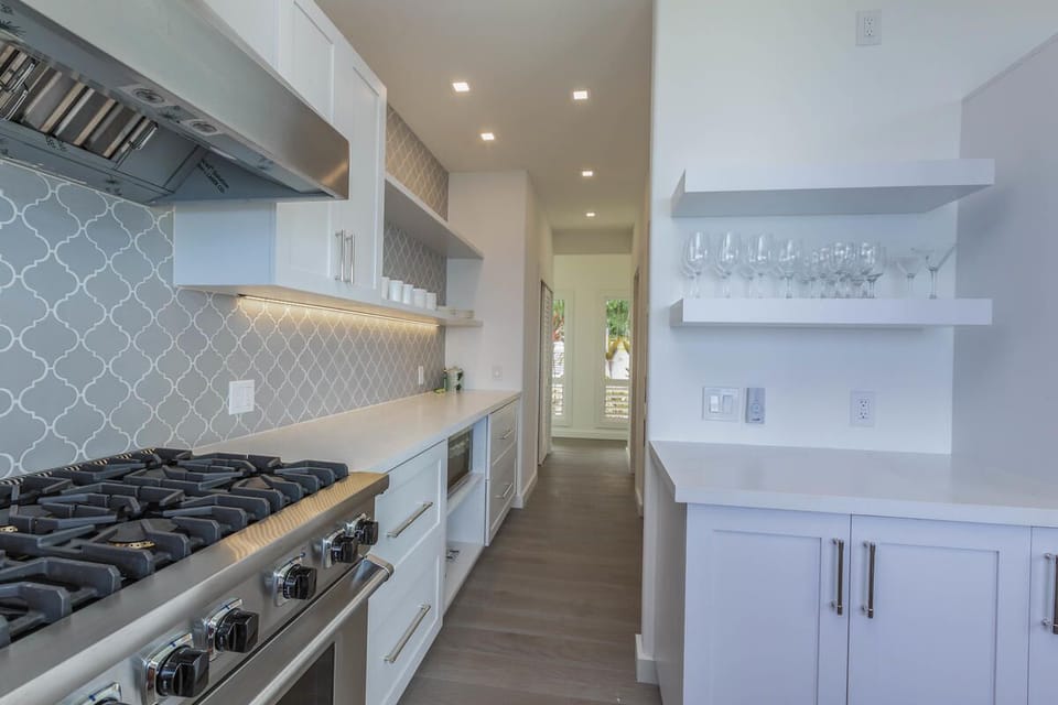 Chef’s kitchen fully equipped with top-of-the-line appliances and ample counter space.