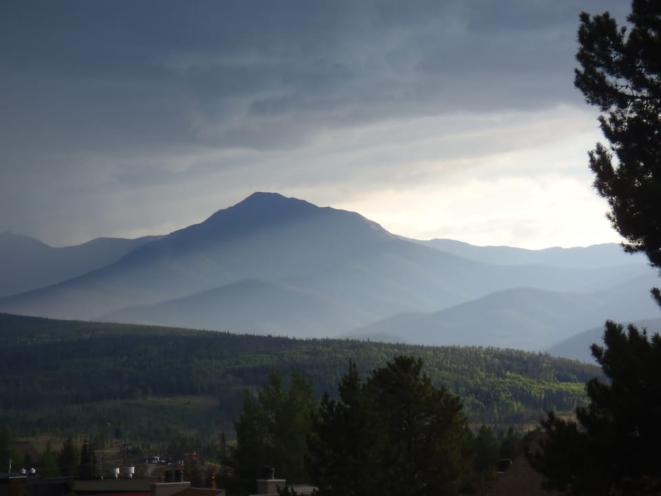 Summer Storm brewing on Byers Peak.  Viewed from living room and  balcony.