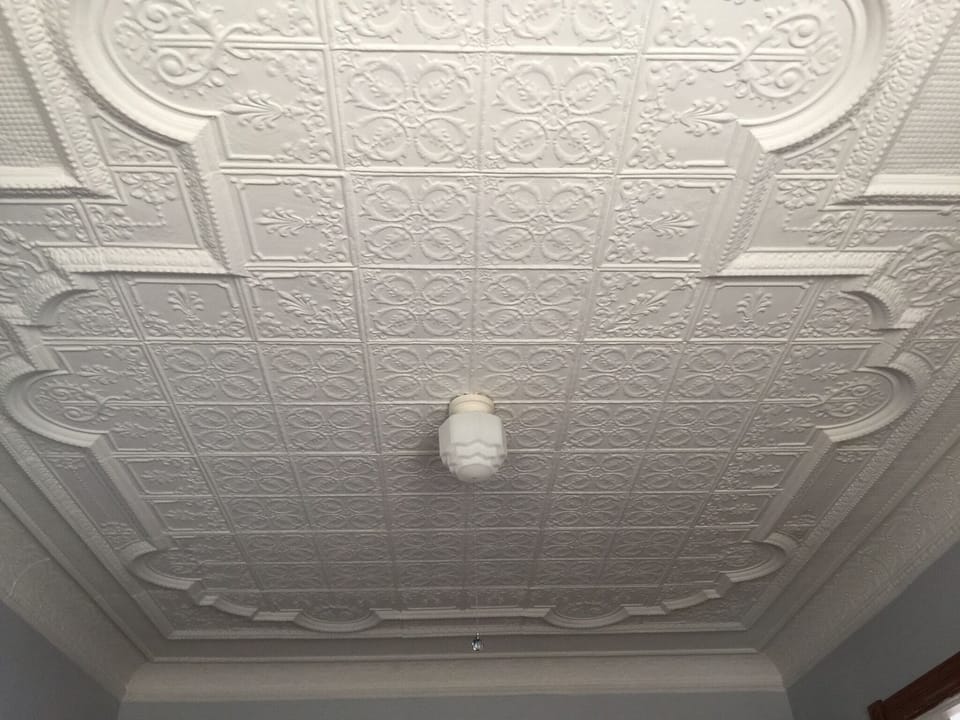 Original tin ceiling in living room. Beautiful! Can stare at it for hours.