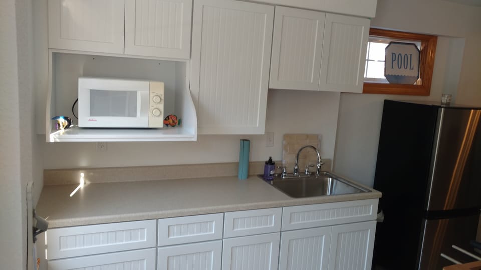 Lower level kitchenette. Just inside from the pool.