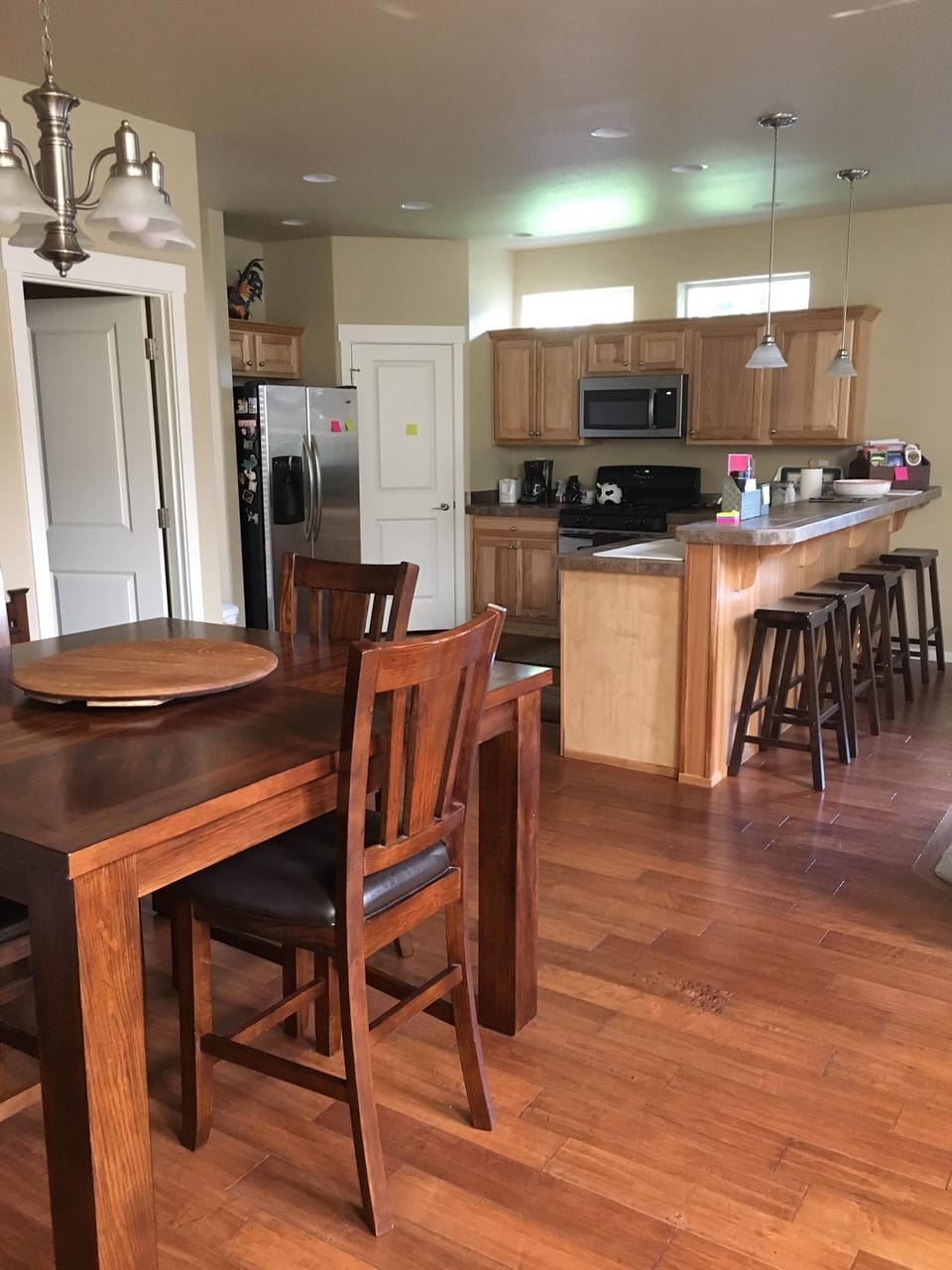 Open dining room and kitchen - table seats 6 and bar seats 4