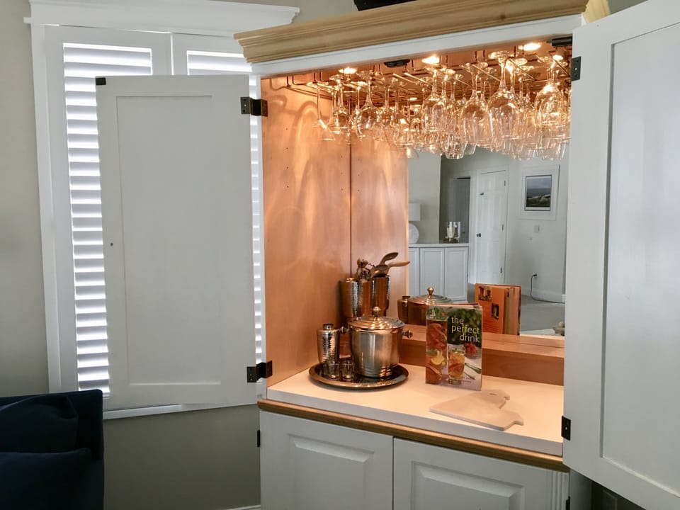 GREAT ROOM BAR CABINET: STOCKED WITH SUPPLIES READY FOR YOU TO BYOB