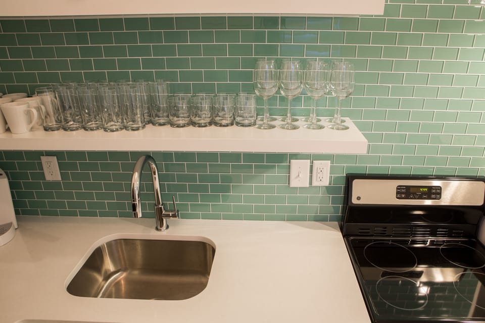 Simple clean stainless sink with disposal.