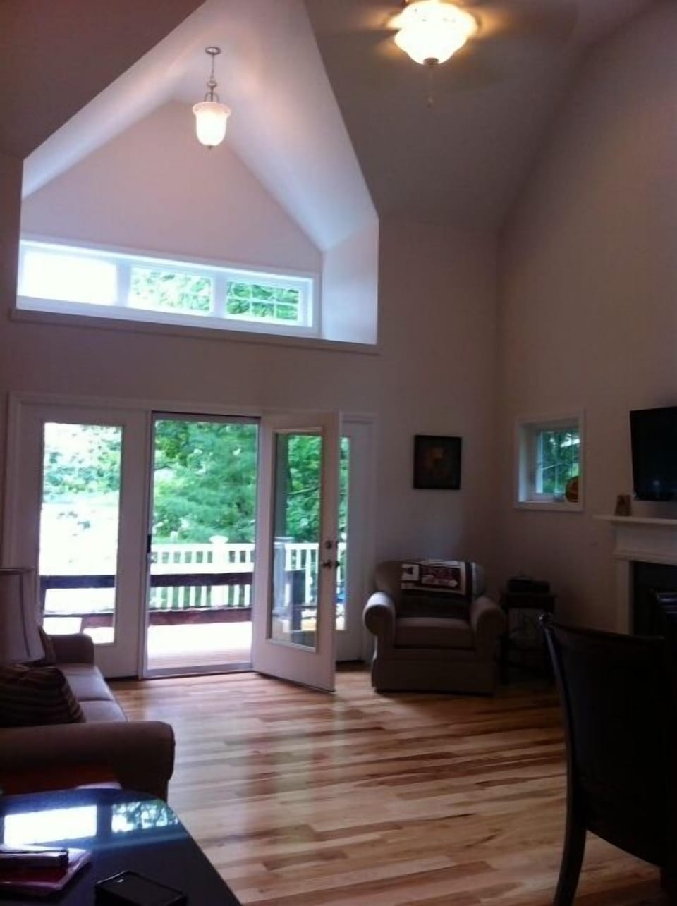 Living room opens up to large deck and beautiful, unobstructed views of the lake