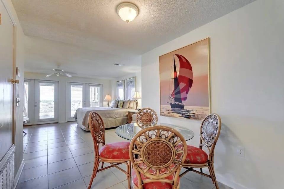 Frend doors out to a patio and the Gulf beyond