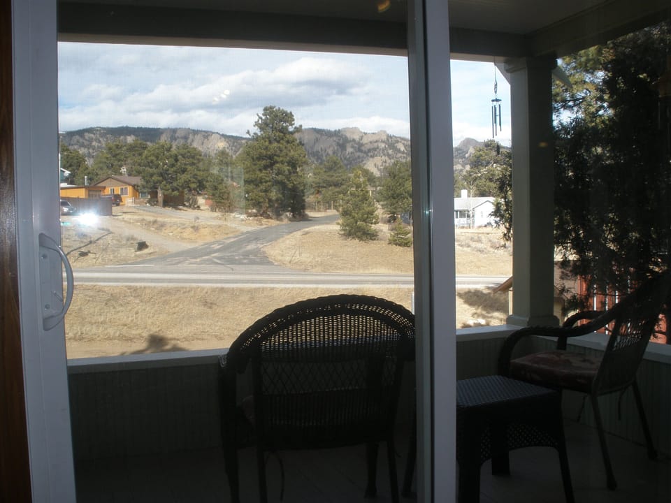 View from living room through patio door..   Looking at Lumpy Ridge..