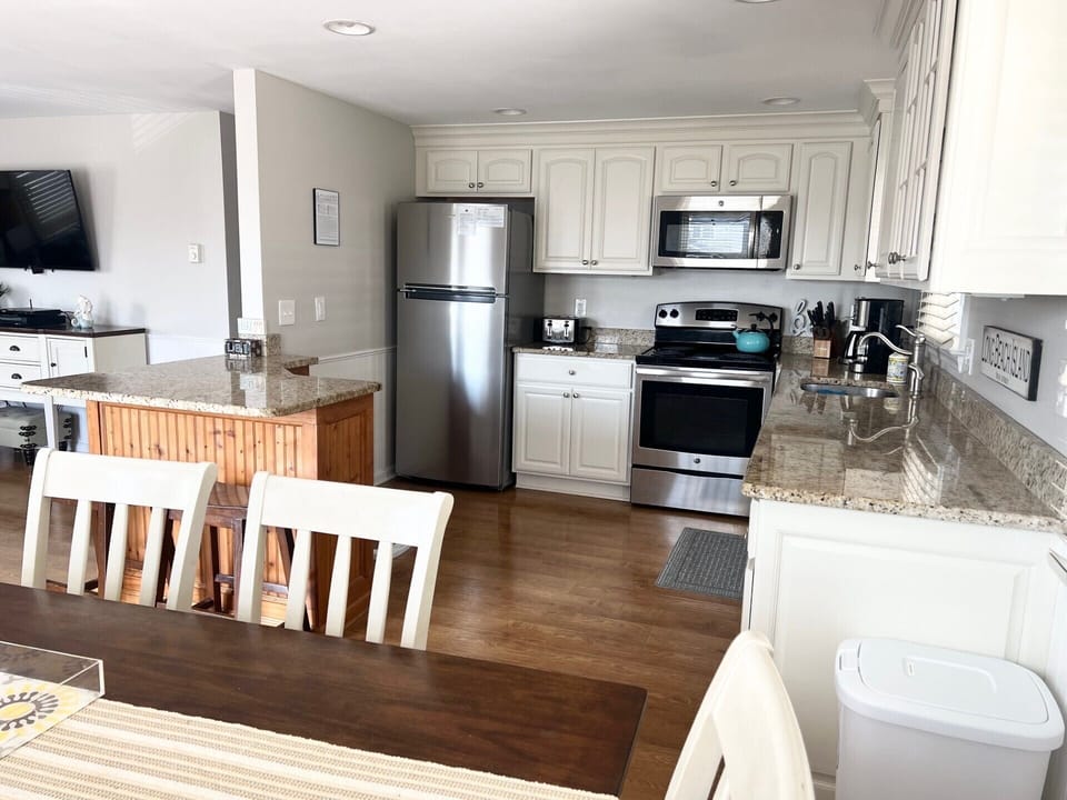 Kitchen: refrigerator, electric stove and oven, dishwasher, microwave