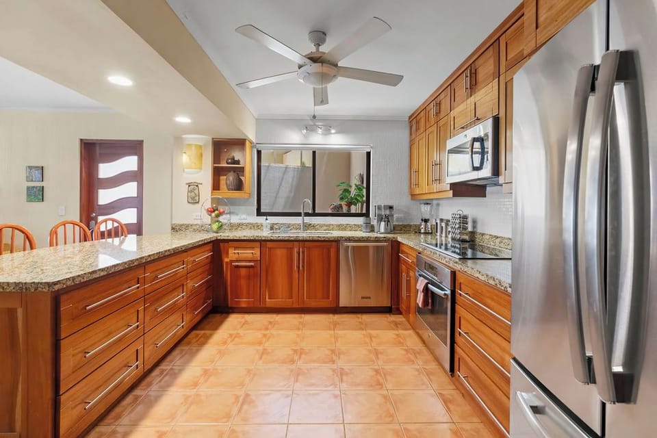 The kitchen has plenty of room for cooks -- fun for family and entertaining. 