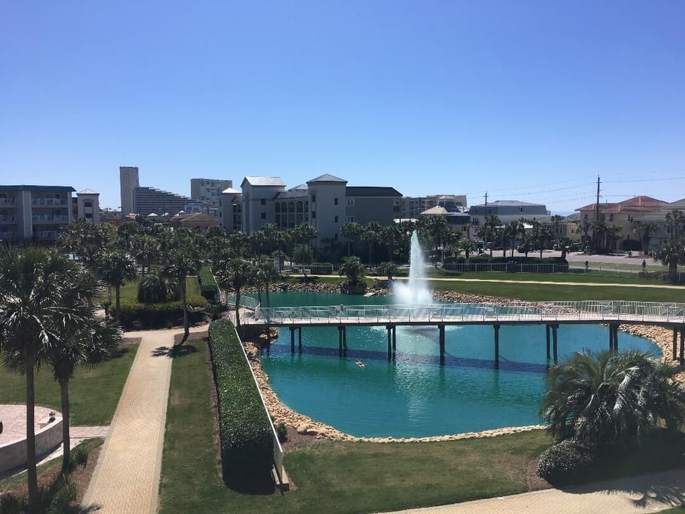 Pond, fountain and footbridge from balcony