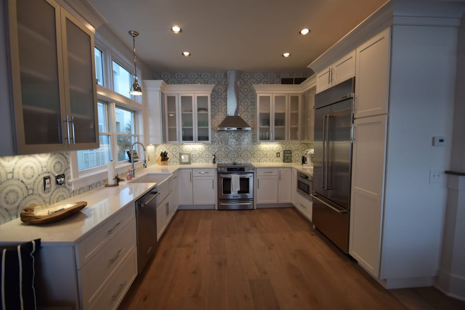 All new kitchen with quartz counters Kitchenaid appliances, mosaic backsplash