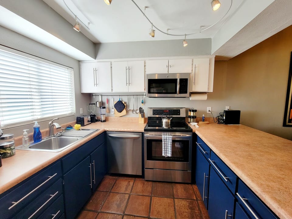 Functional kitchen with plenty of workspace, modern updates,stainless appliances