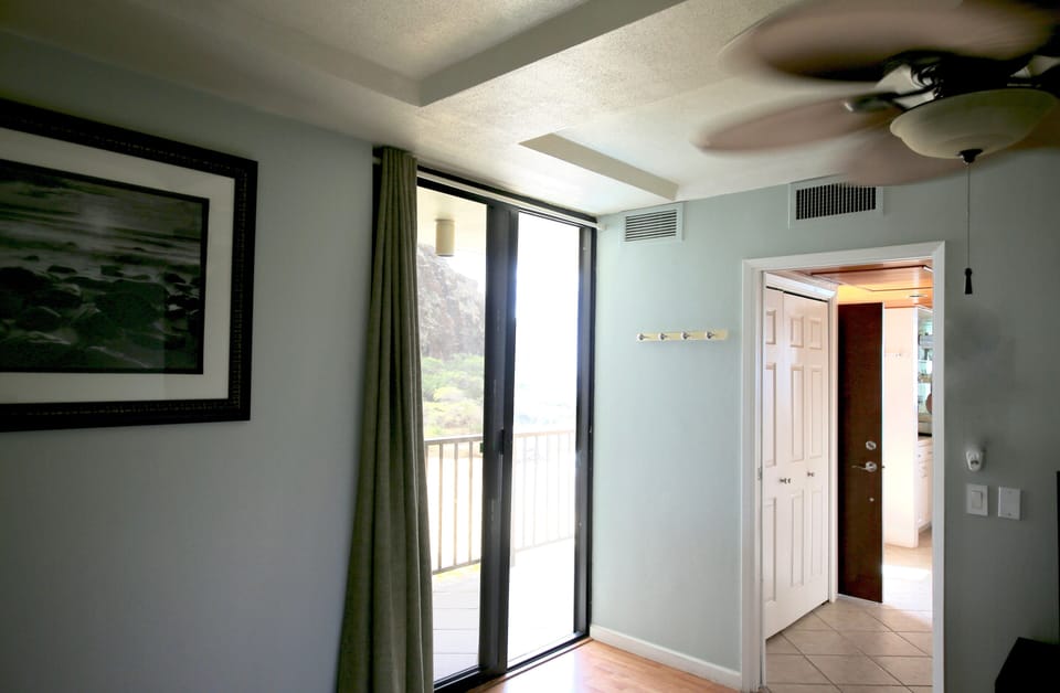 patio door from the bedroom with direct access to the lanai