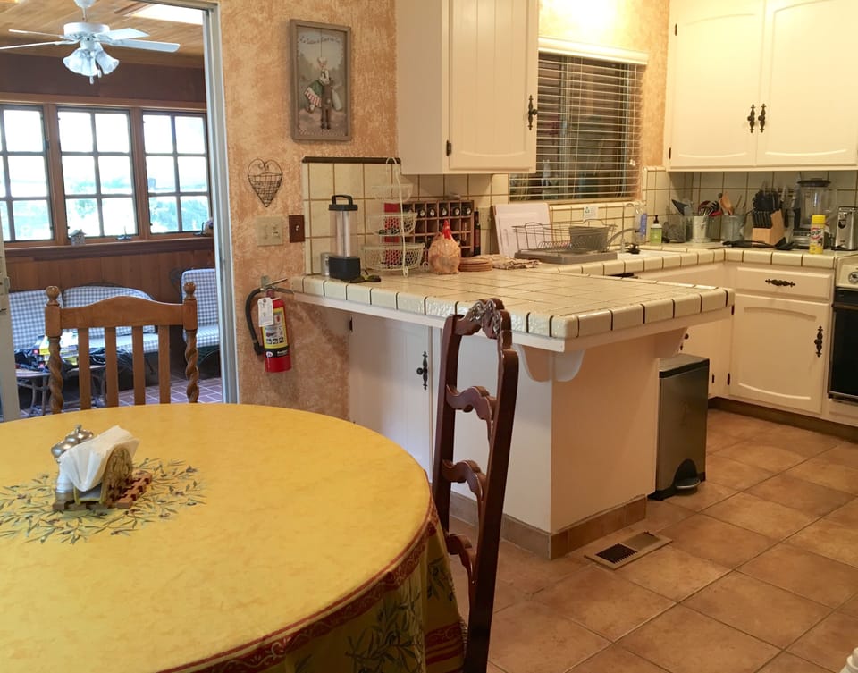 Another view of the kitchen, dining and sun porch area.