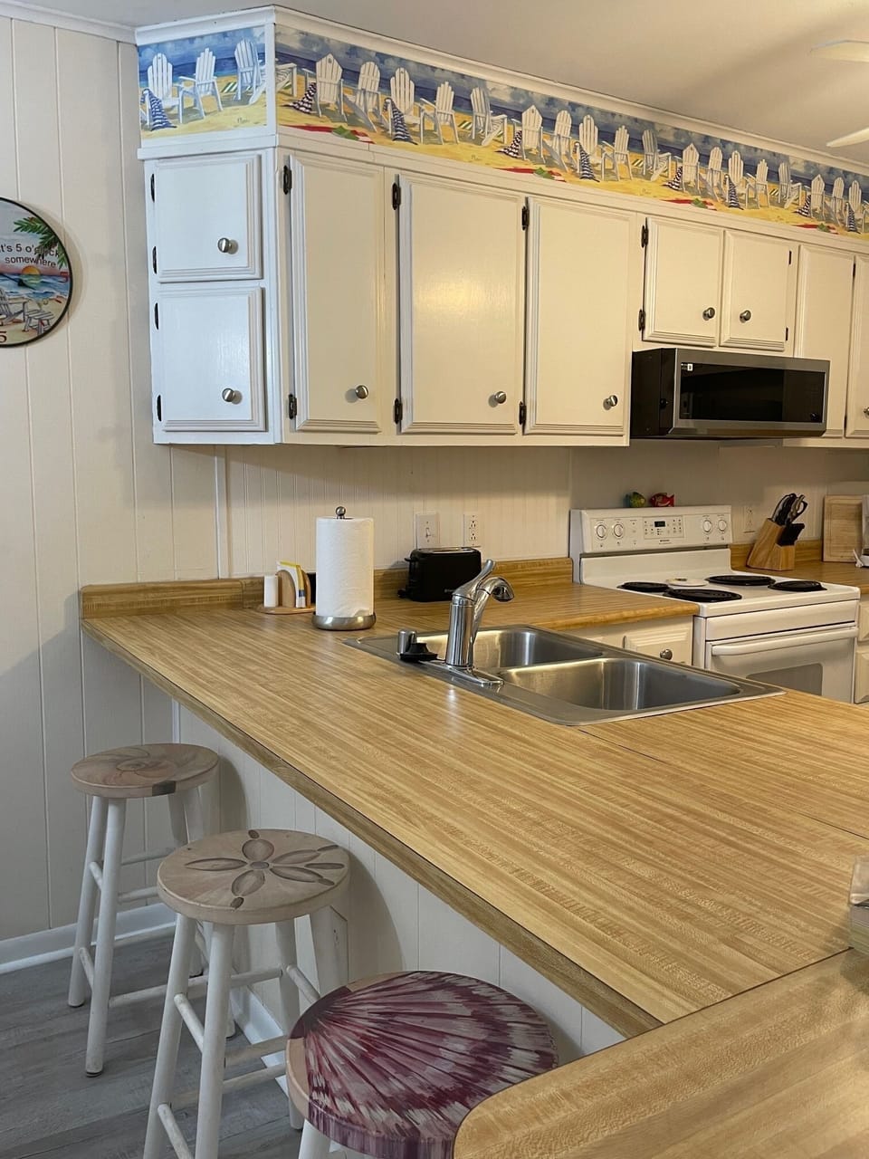 Kitchen includes new beadboard back splash and low profile microwave.