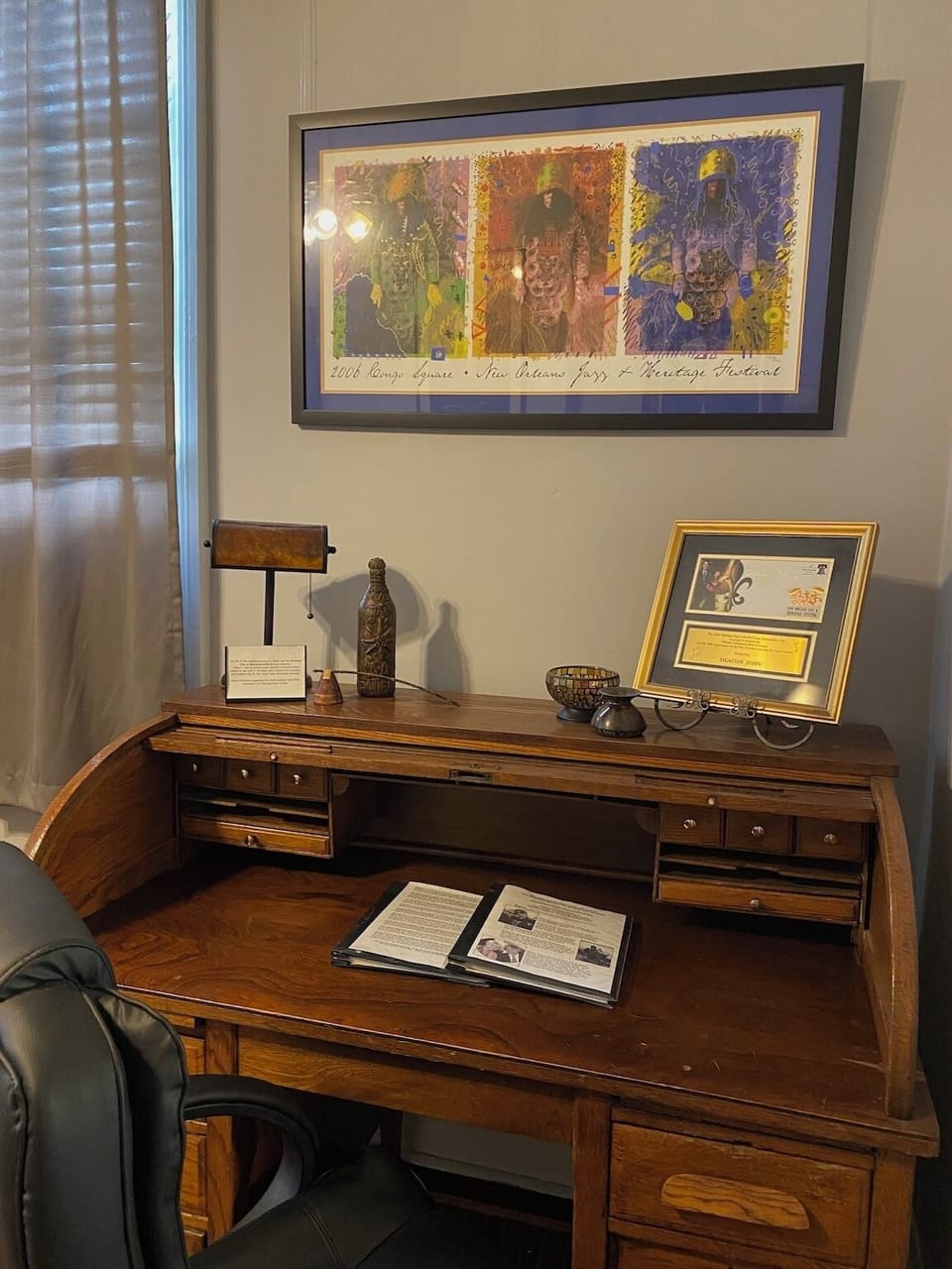 Antique roll-top desk with new office chair and wi-fi high speed internet.