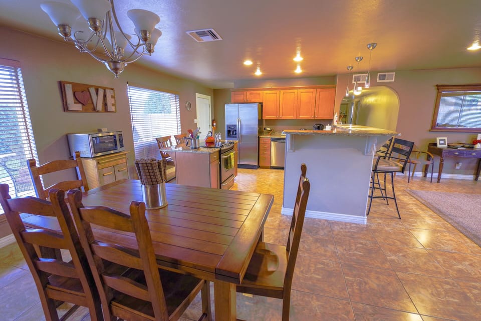 Dining room table with two extensions at each end to seat your family & friends.
