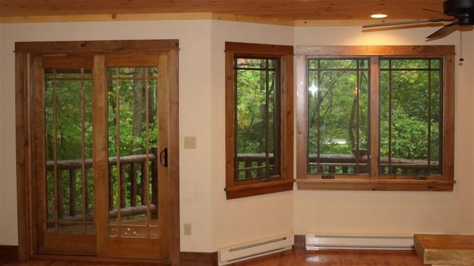Main level windows/sliding door to rear deck