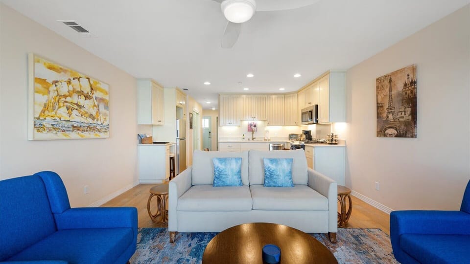 Open concept kitchen, dining, and living spaces