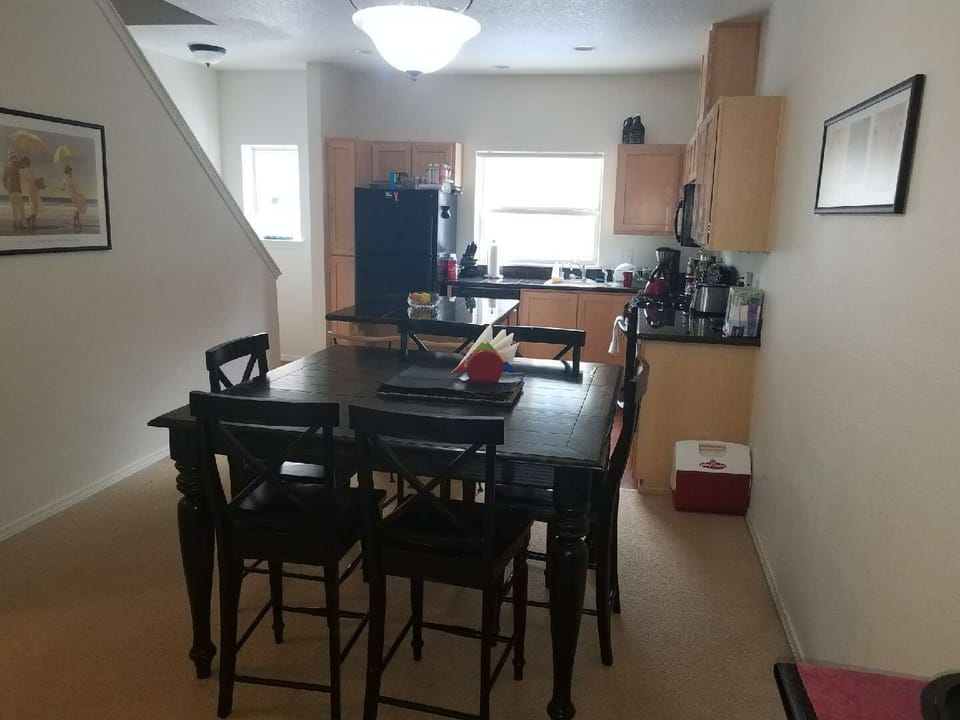 Dining room with large Bar Height 6-person dining table.