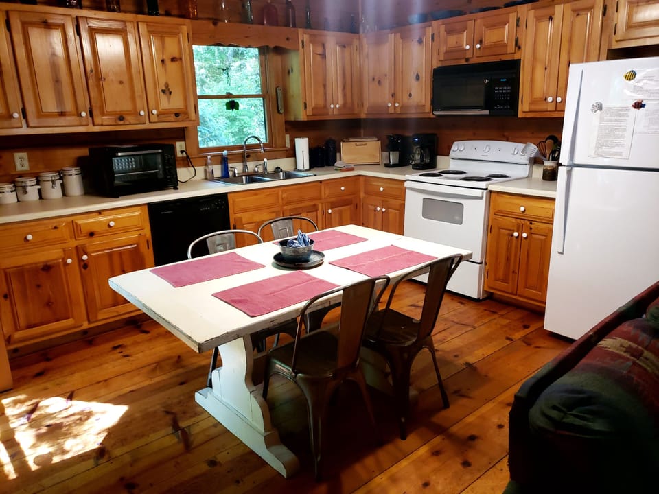 Get creative in fully stocked  kitchen.  Table for 6; extra chairs provided.